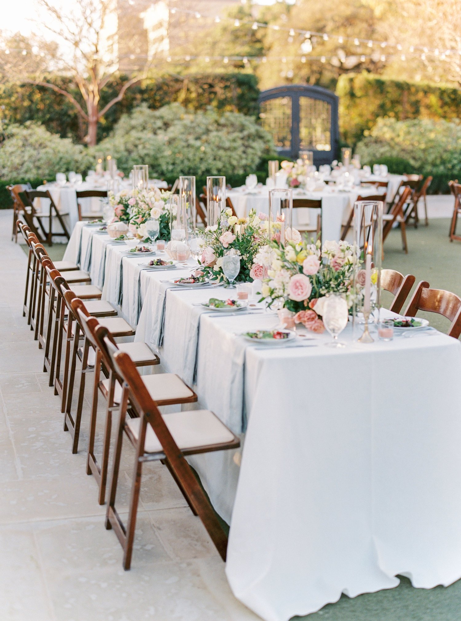 Long reception tablescape with blush and greenery