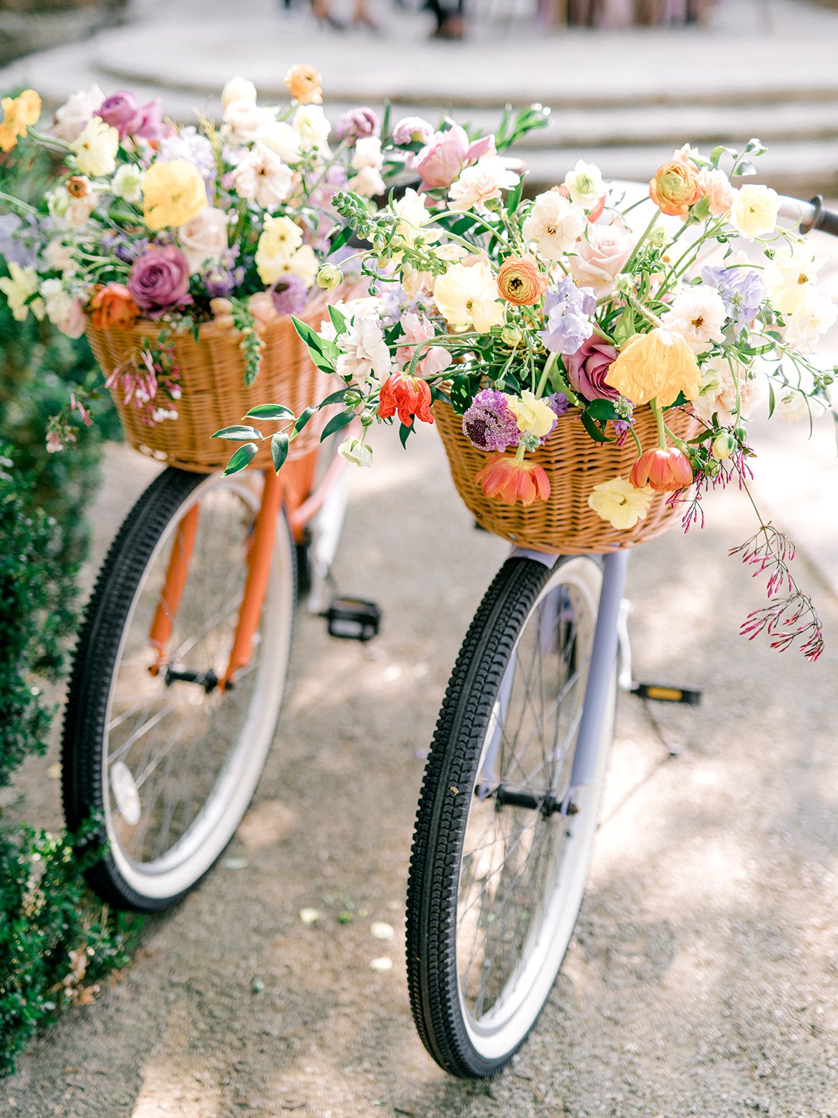 Vintage bicycle with a basket overflowing with garden florals